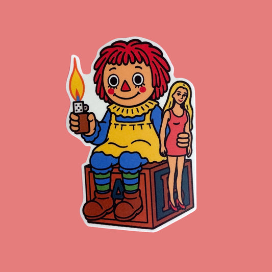 Colorful illustration of a Raggedy Anne holding a lighter while sitting on a box and holding a doll